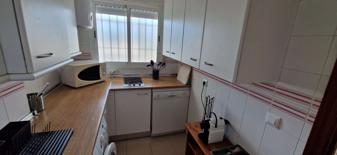 Apartamento Laguna de El Portil, alquiler temporada, piscina, pista de pádel, terraza acristalada, plaza de garaje

