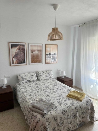 Apartamento Laguna de El Portil, alquiler temporada, piscina, pista de pádel, terraza acristalada, plaza de garaje

