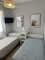 Apartamento Laguna de El Portil, alquiler temporada, piscina, pista de pádel, terraza acristalada, plaza de garaje

